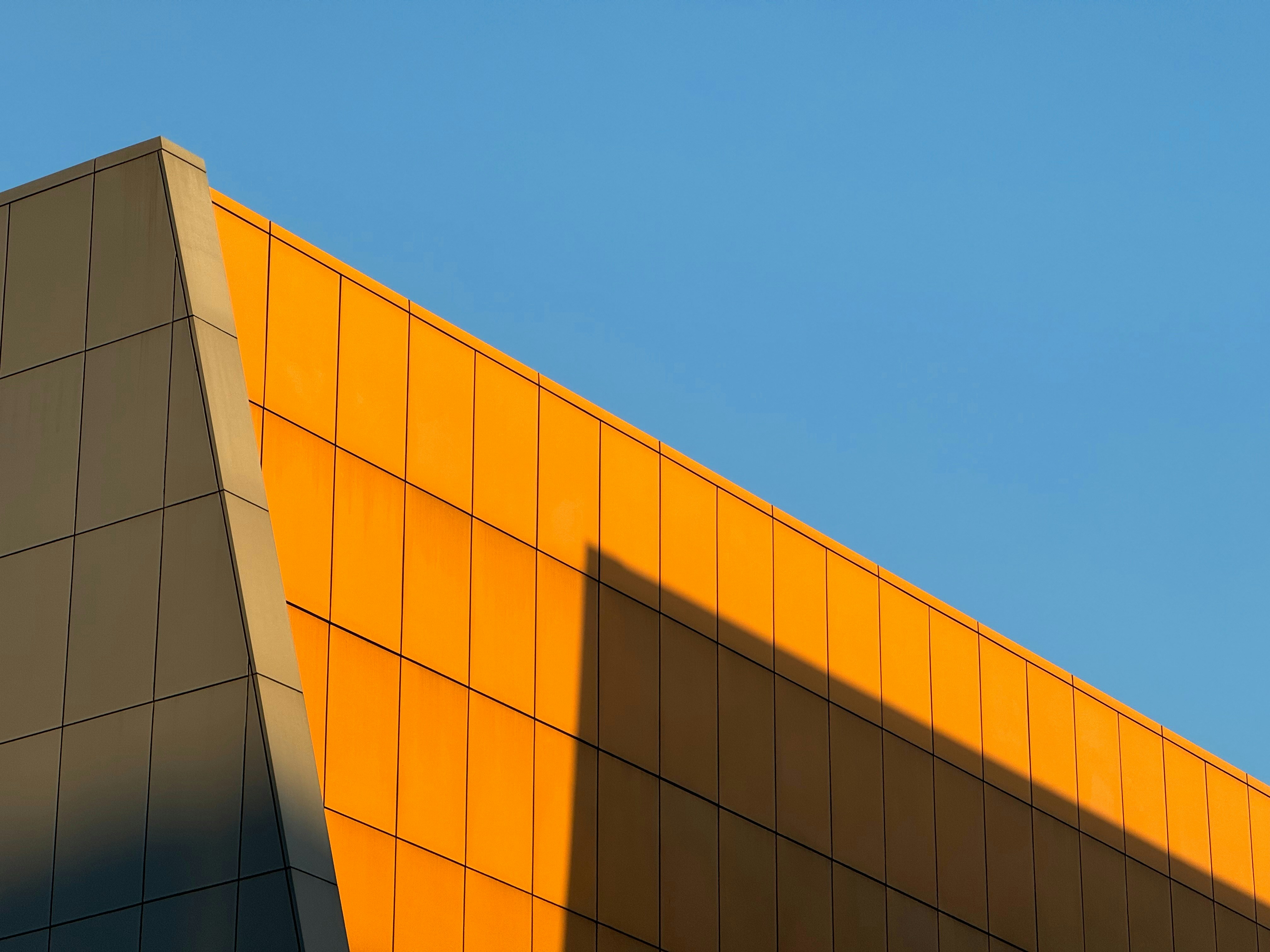 Photo of a study hall with wooden tables and chairs.